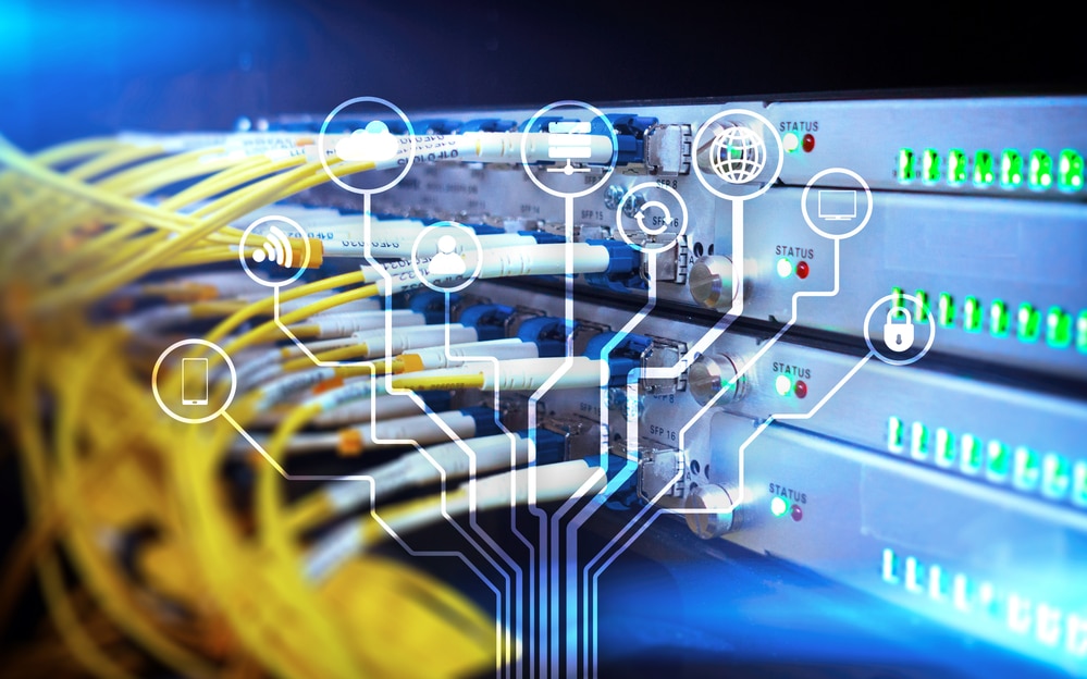 Telecommunication parts with bright lights and yellow cables, with an overlay of mind map.